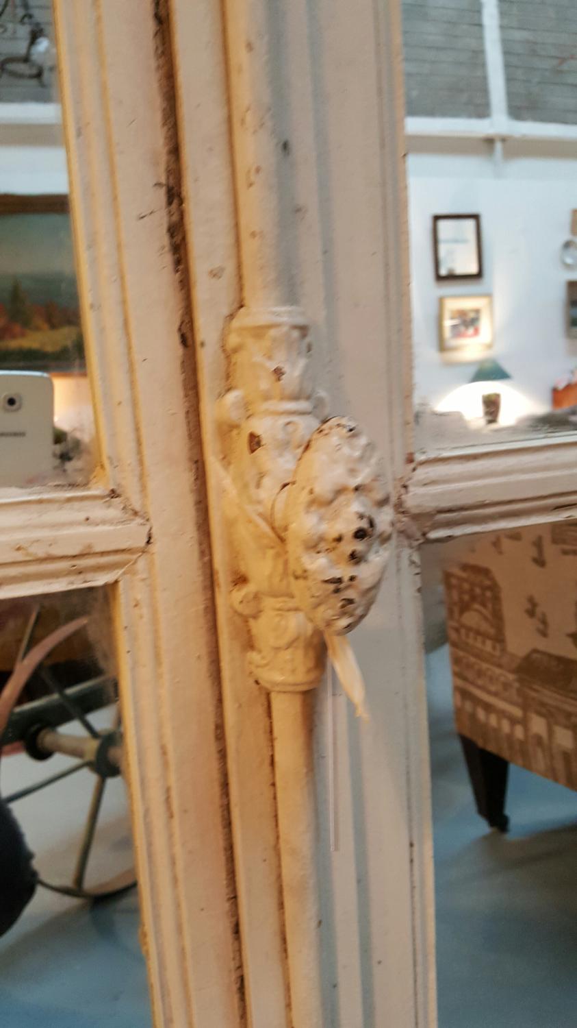 Pair of salvaged French windows with mirrors