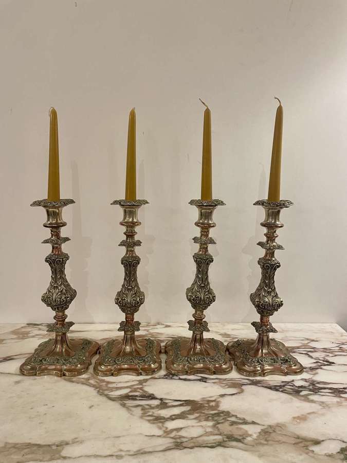 Set of four 19th century silver plated on copper candle sticks