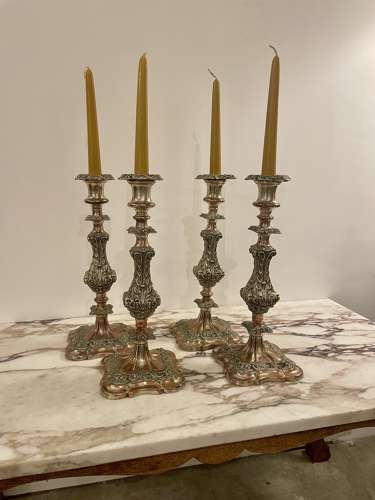 Set of four 19th century silver plated on copper candle sticks