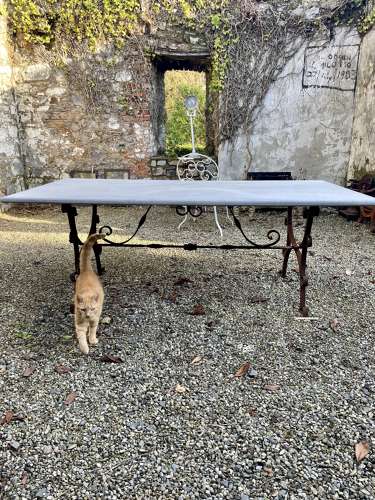 Large limestone top table  on antique wrought iron base
