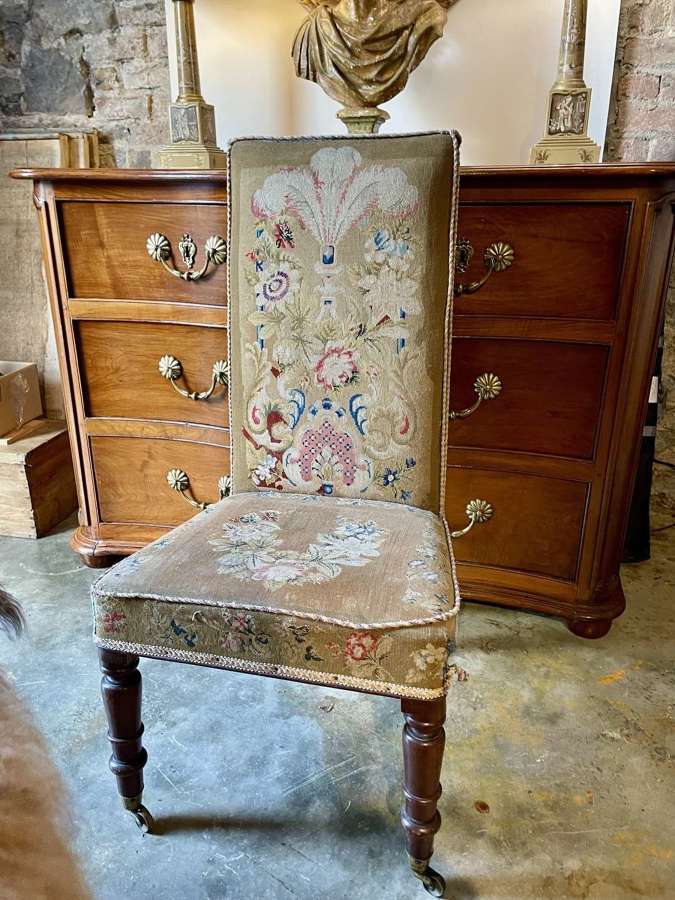 19thC mahogany occasional chair with turned legs on brass castors