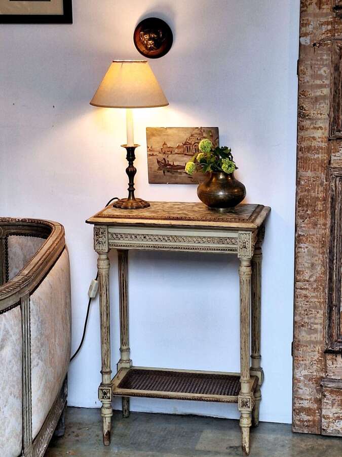 Louis XIV style occasional marble top table with rattan shelf