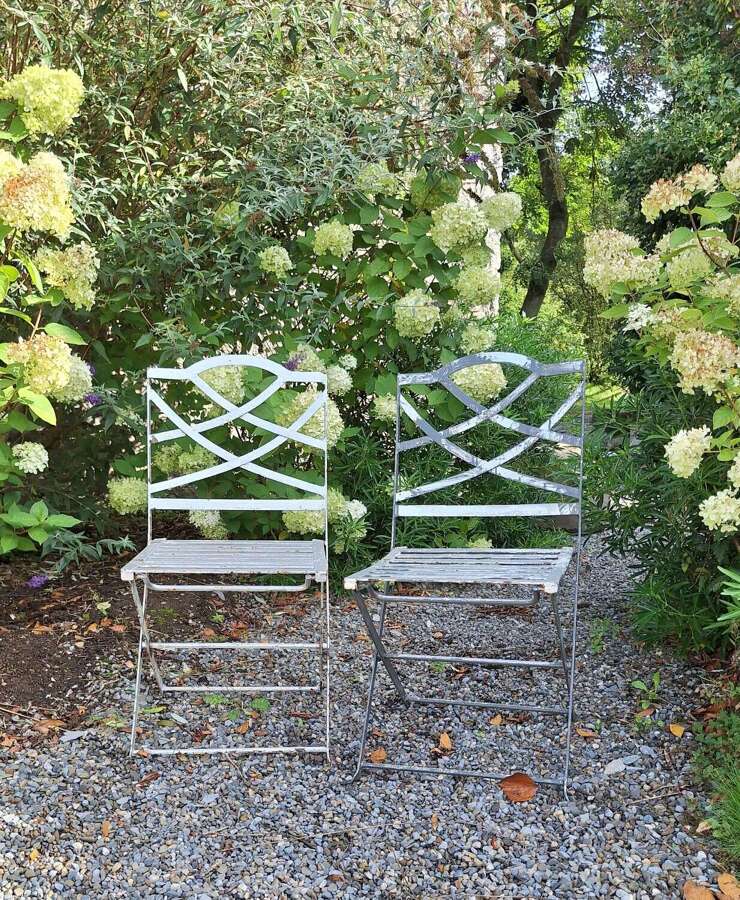 Pair of heavy folding French garden chairs
