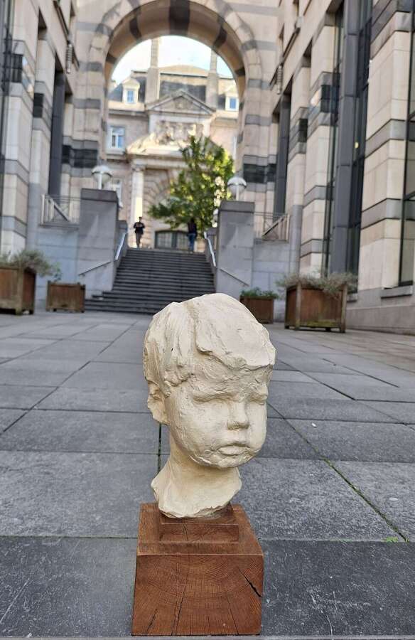 1930's plaster head of a child on wooden base