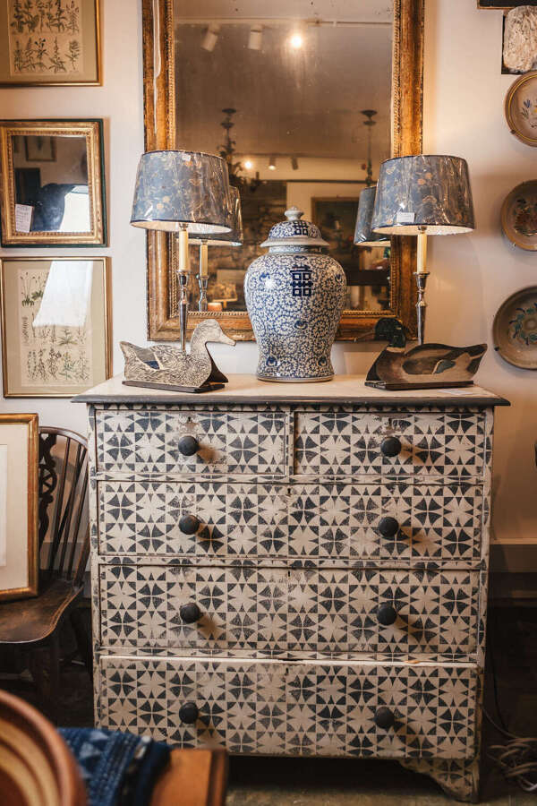 Antique pine chest of drawers with later painted geometric pattern