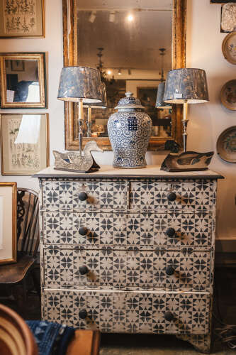 Antique pine chest of drawers with later painted geometric pattern